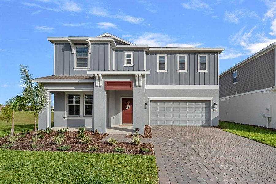 Front exterior of a new home in Wellness Ridge, Clermont, FL, highlighting curb appeal (Image 28).