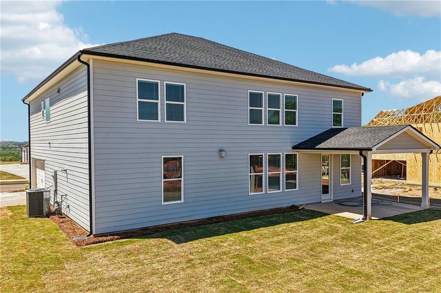 Exterior details and patio area of a home in River Pointe, Monroe (Image 4).