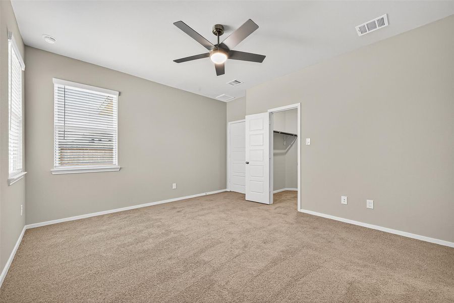 Spacious, unfurnished interior of a new home in Sunterra, Katy (Image 29).