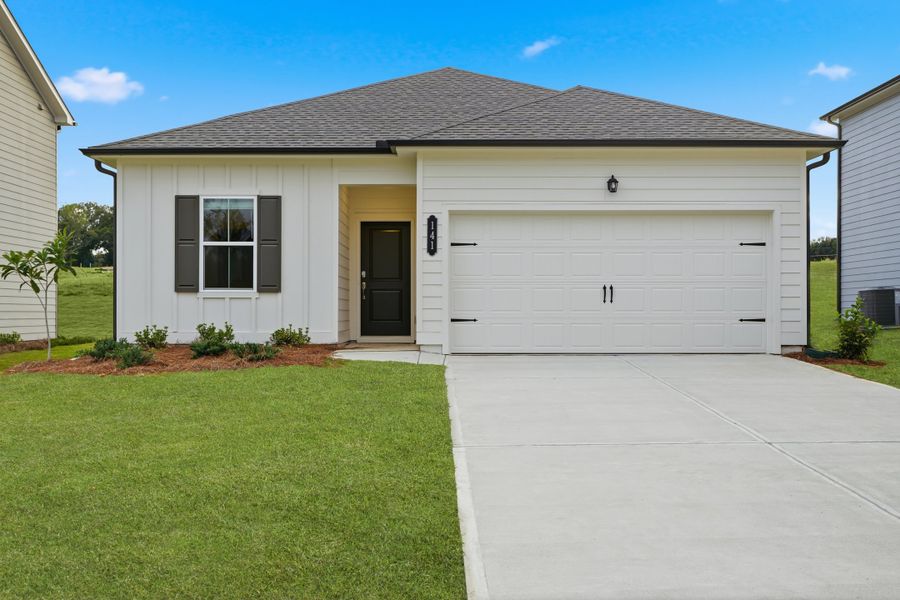 Front exterior of a new home in Crossvine Village, LaGrange, GA, highlighting curb appeal (Image 1).
