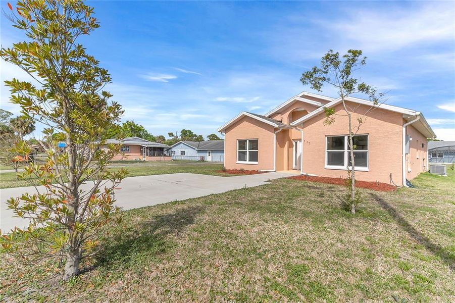 Front exterior of a new home in , New Smyrna Beach, FL, highlighting curb appeal (Image 17). Front exterior of a new home in , New Smyrna Beach, FL, highlighting curb appeal (Image 17).
