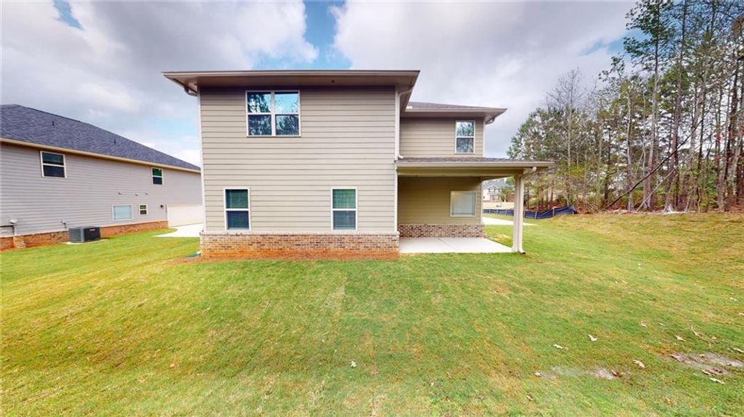 Exterior details and patio area of a home in Mirror Lake at South Harbour, Villa Rica (Image 3).