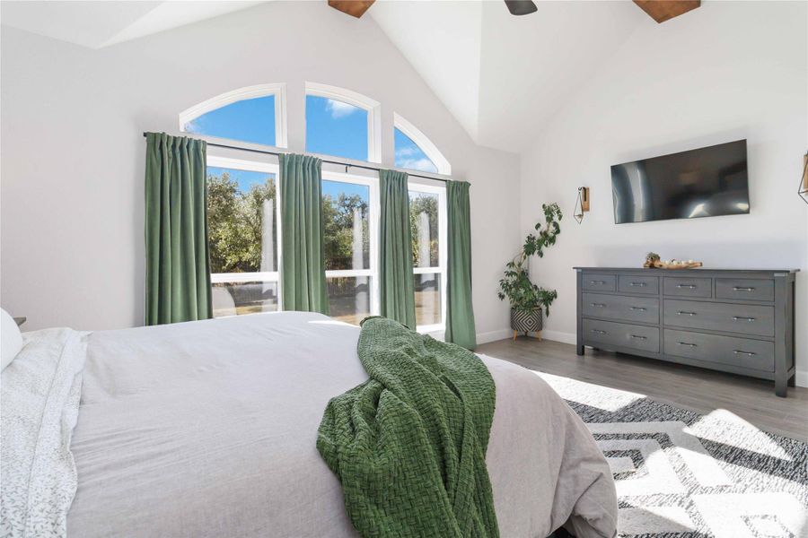 Bedroom with wood finished floors and ceiling fan Bedroom with wood finished floors and ceiling fan