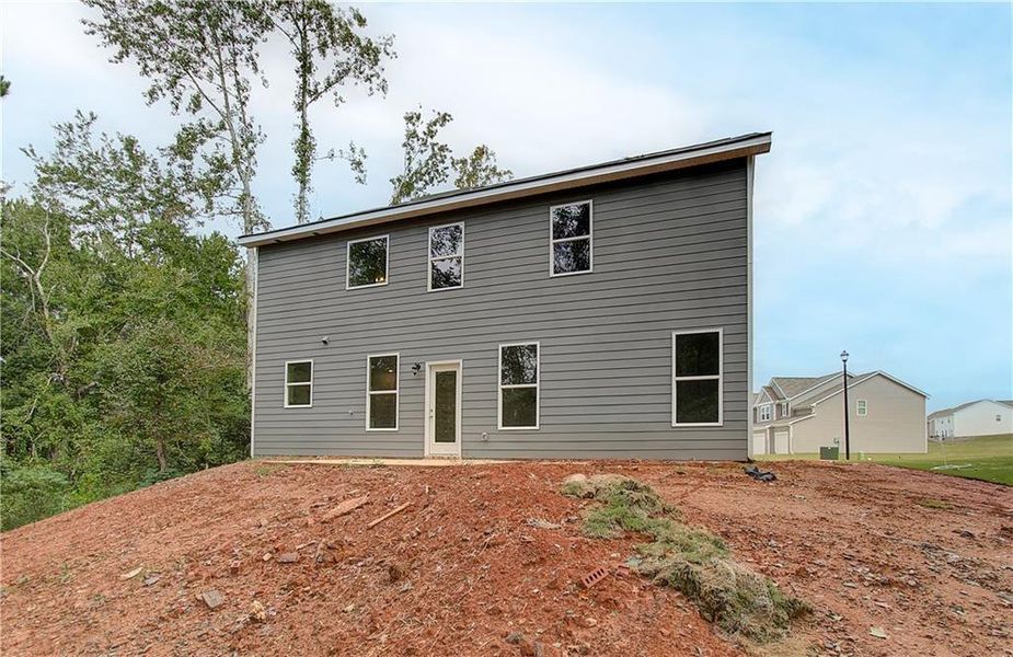Exterior details and patio area of a home in Berkeley Lakes, Locust Grove (Image 19).