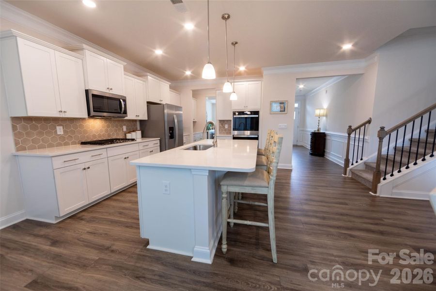Kitchen with a double wall oven and abundant cabinetry.