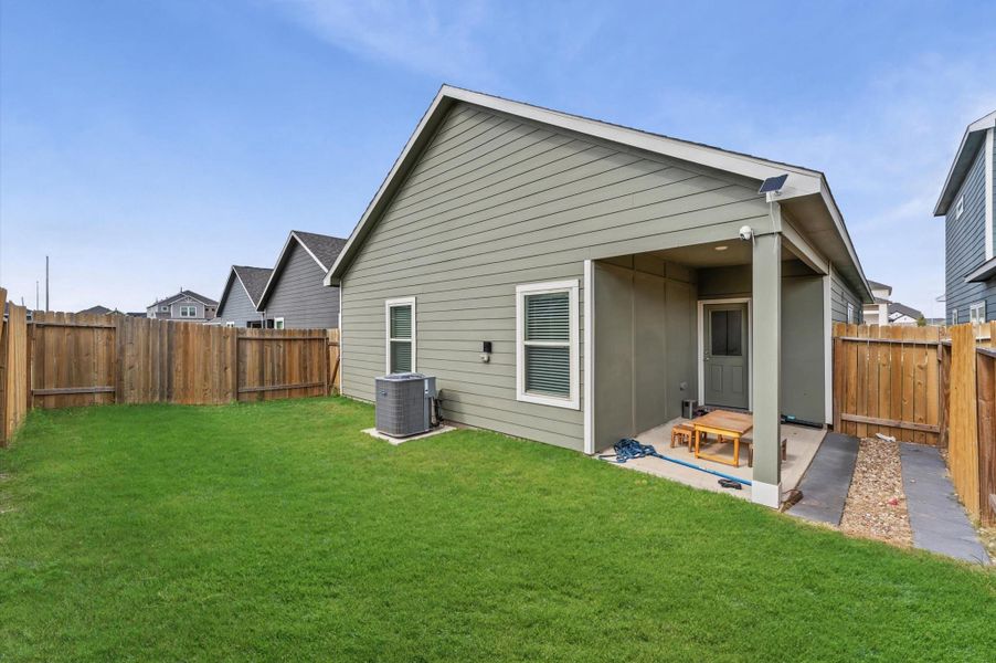 Exterior details and patio area of a home in Cypress Oaks North, Cypress (Image 21).