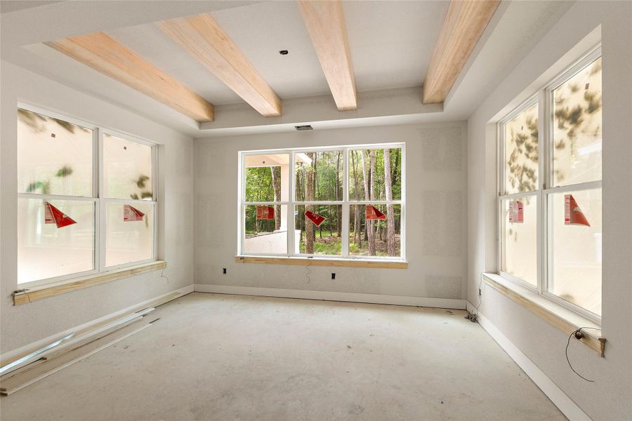 Surrounded by windows, the dining room enjoys views of the trees. Surrounded by windows, the dining room enjoys views of the trees.