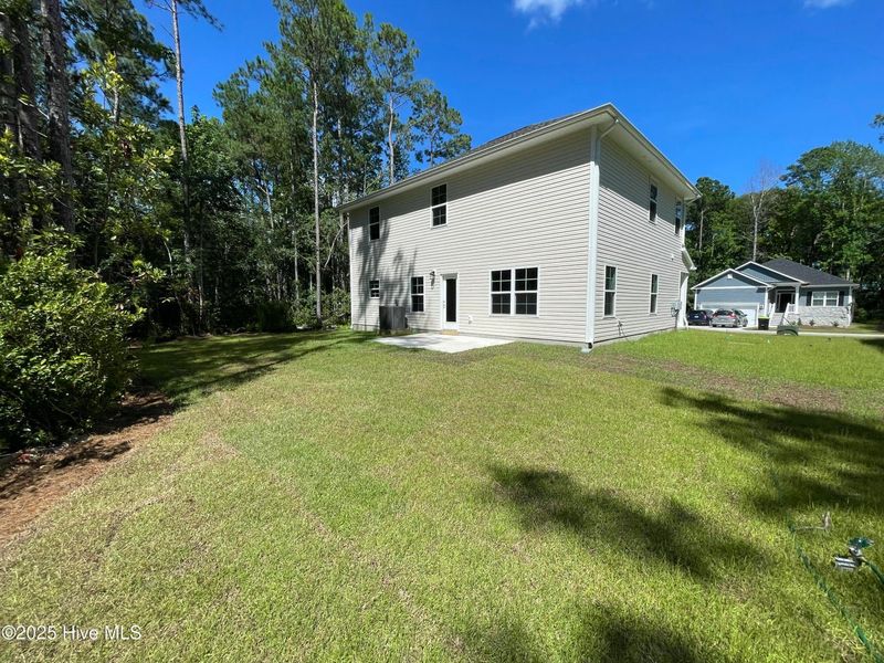 Front exterior of a new home in Mill Creek Cove, Bolivia, NC, highlighting curb appeal (Image 19).