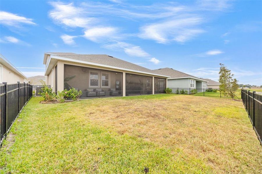 Exterior details and patio area of a home in Seaire, Parrish (Image 31).