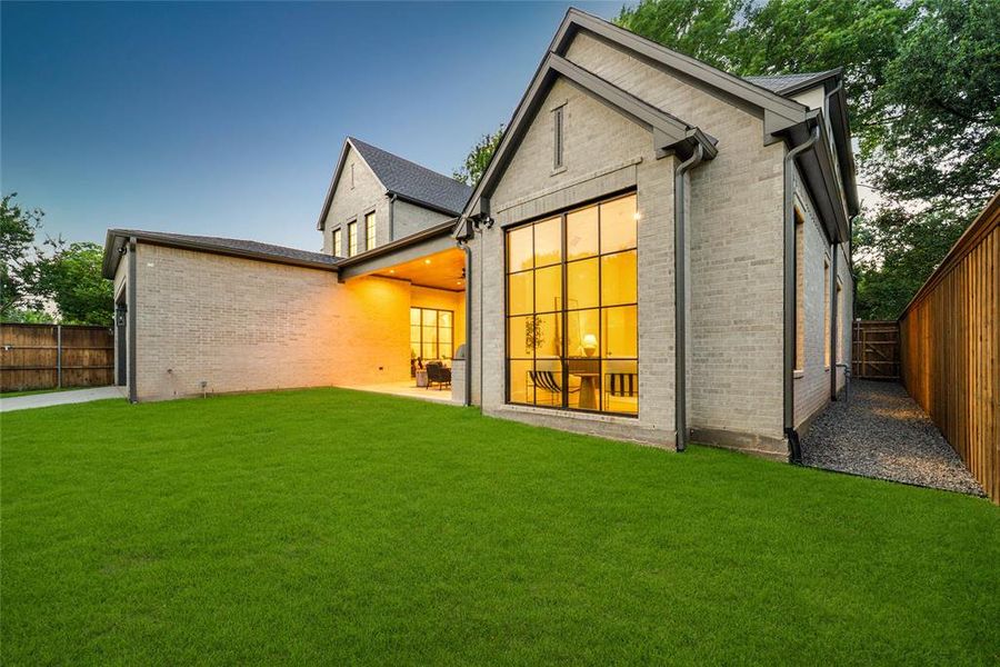 Gray brick exterior featuring black-framed windows and dark gray gutters