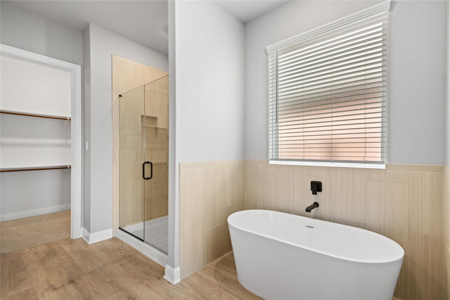Luxurious primary bath featuring a spacious soaking tub.