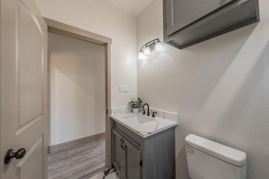 Bathroom with vanity and light wood finished floors