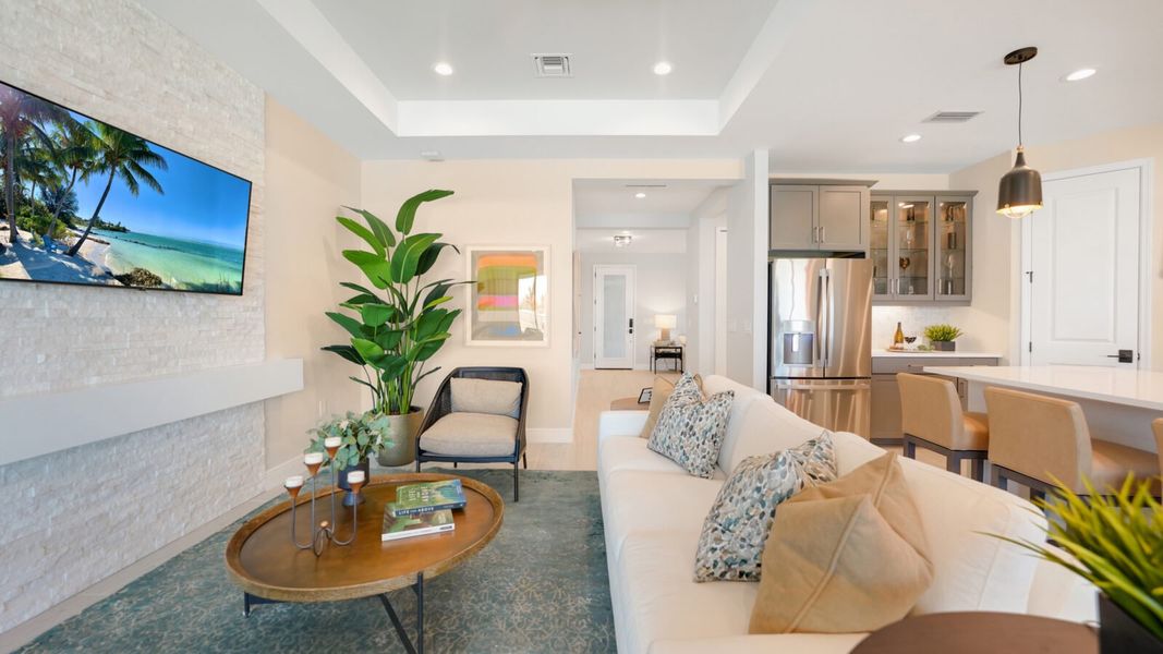 Representative furnished interior of a home built from the Meadow Brook by Neal Communities in SkySail, Naples (Image 8).