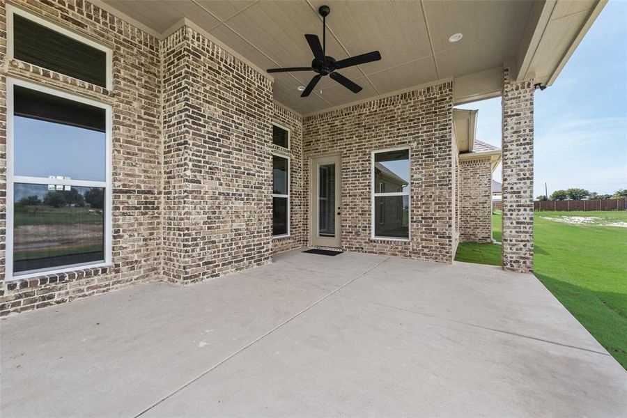 View of patio featuring a ceiling fan