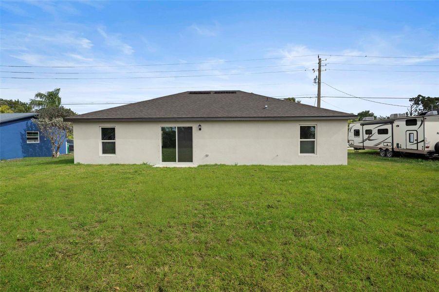 Front exterior of a new home in , Port St. Lucie, FL, highlighting curb appeal (Image 13).
