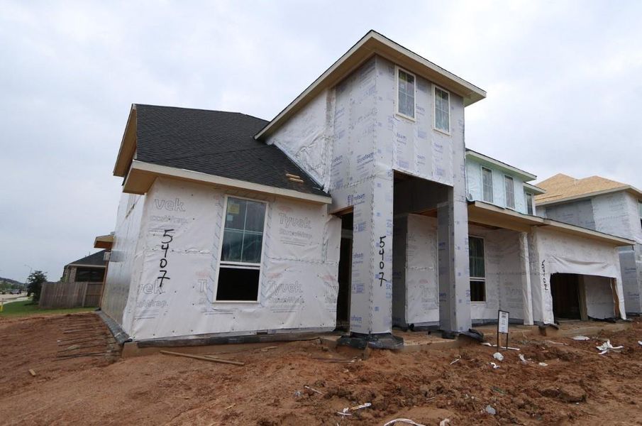 Front exterior of a new home in Cross Creek Ranch 65′, Fulshear, TX, highlighting curb appeal (Image 2).