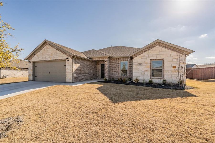 Front exterior of a new home in Stone Eagle, Azle, TX, highlighting curb appeal (Image 20).