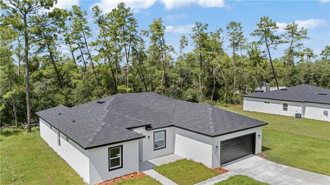 Front exterior of a new home in , Ocala, FL, highlighting curb appeal (Image 28).