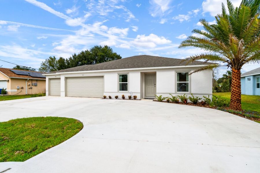 Representative exterior photo of a completed home built from the Alexander by Holiday Builders in Poinciana, Poinciana, FL (Image 1).
