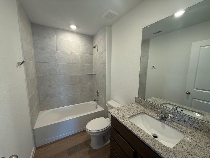 Furnished interior view inside a new home in Midtown Reserve, College Station (Image 6).