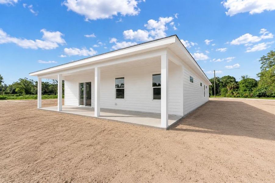 Exterior details and patio area of a home in , Williston (Image 4).