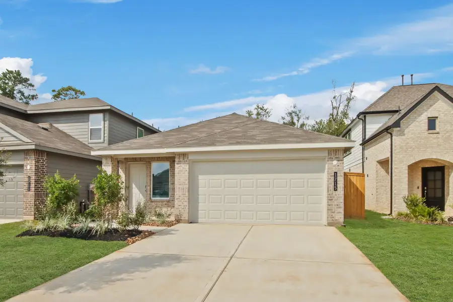 Front exterior of a new home in Venetian Pines, Conroe, TX, highlighting curb appeal (Image 2). Front exterior of a new home in Venetian Pines, Conroe, TX, highlighting curb appeal (Image 2).