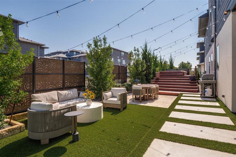 Custom designed backyard: privacy fencing, turf and swim spa trainer