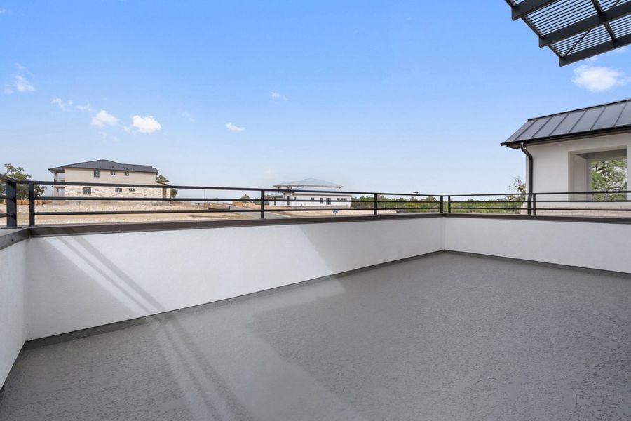 Exterior details and patio area of a home in Milky Way at River Place, Austin (Image 8).