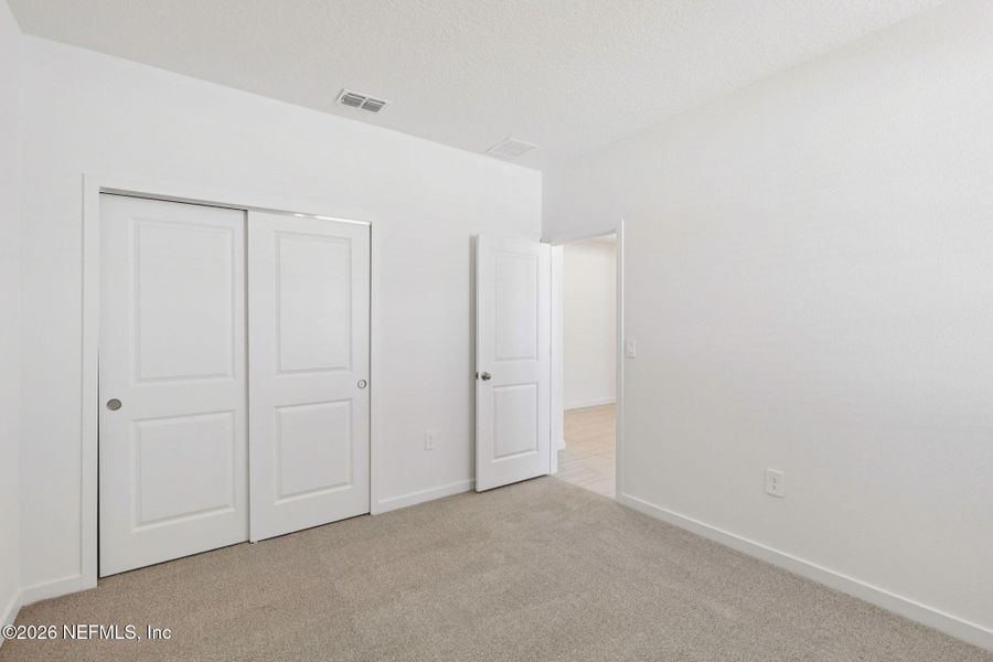 Spacious, unfurnished interior of a new home in Lakes at Bella Lago - Signature Series, Green Cove Springs (Image 31).