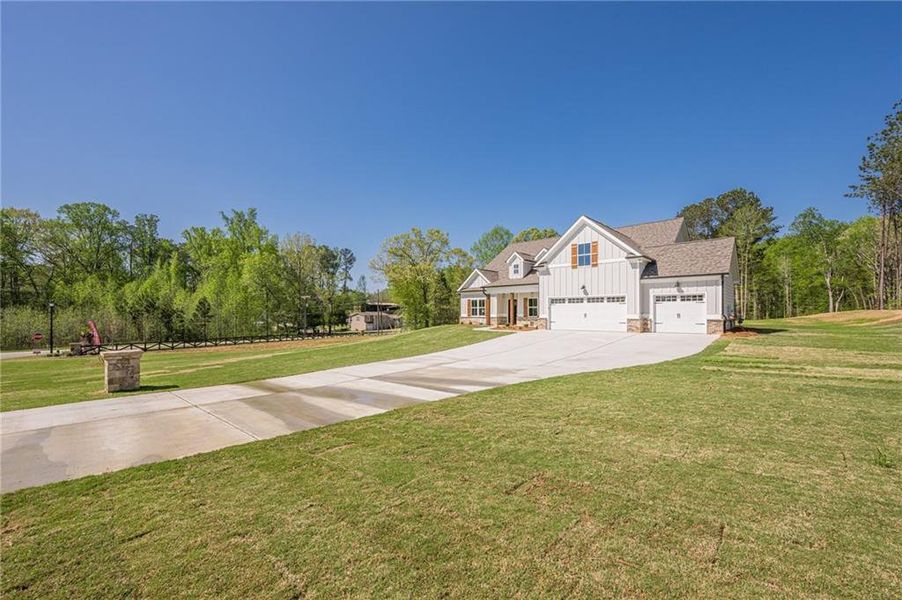 Front exterior of a new home in , Covington, GA, highlighting curb appeal (Image 25).