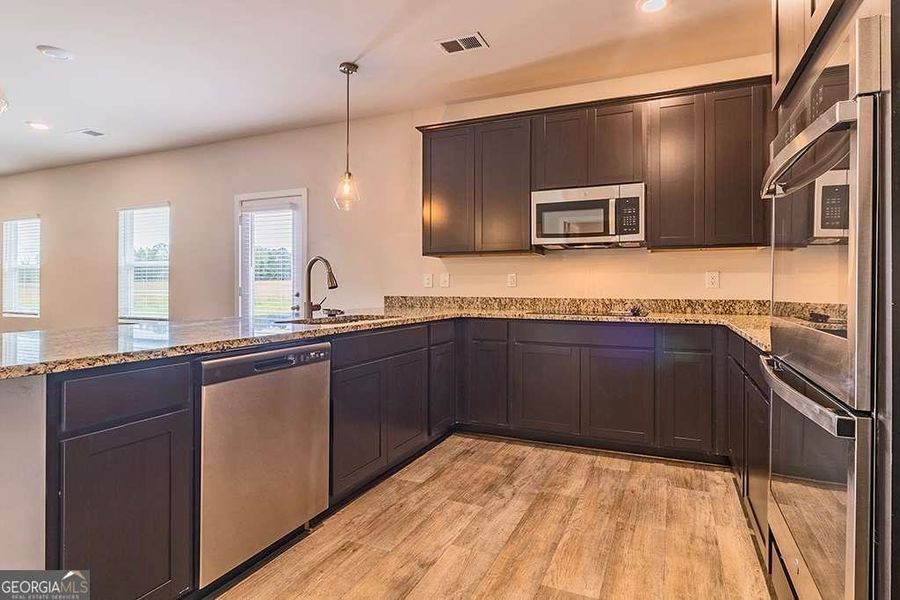 Furnished interior view inside a new home in Fern Dale, Fairburn (Image 4).