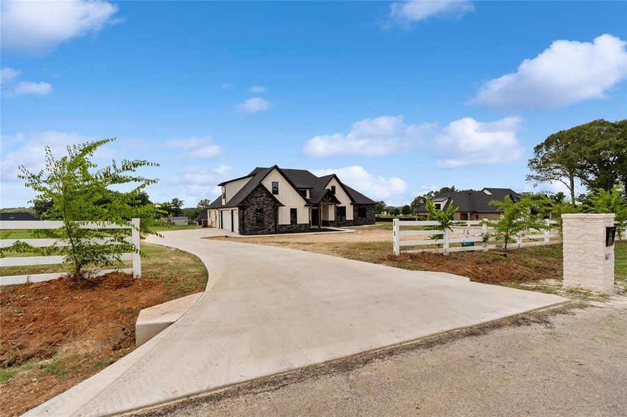 Front exterior of a new home in , Bullard, TX, highlighting curb appeal (Image 22). Front exterior of a new home in , Bullard, TX, highlighting curb appeal (Image 22).