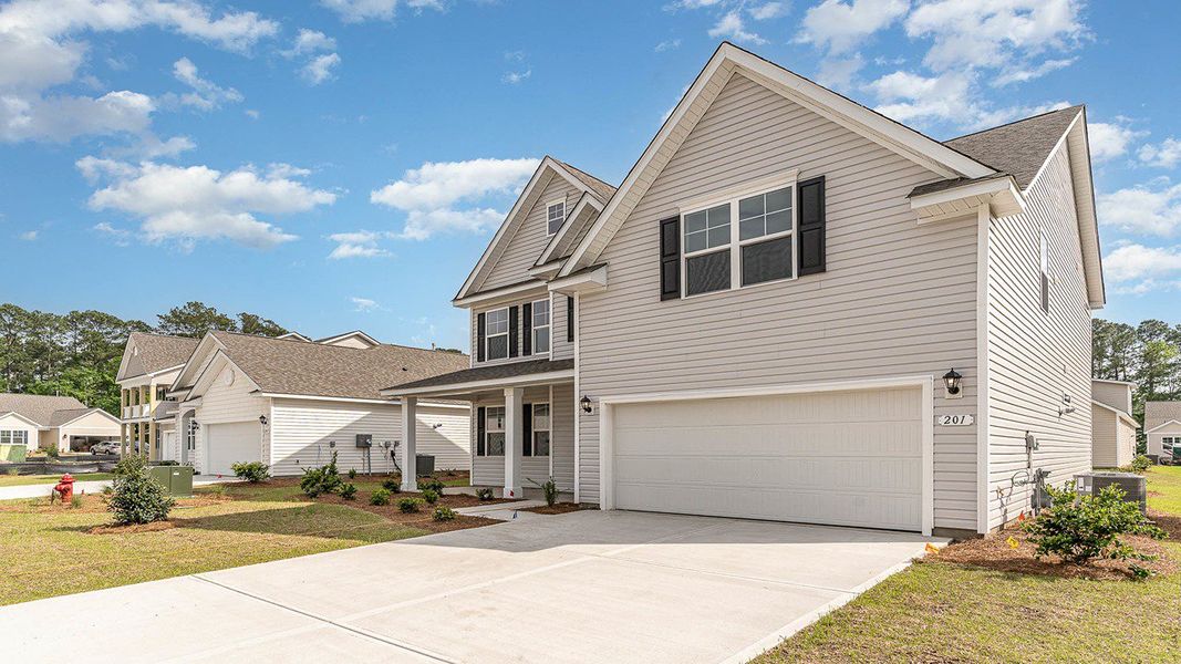 Representative exterior photo of a completed home built from the FORRESTER by D.R. Horton in Haven View, Murrells Inlet, SC (Image 2).