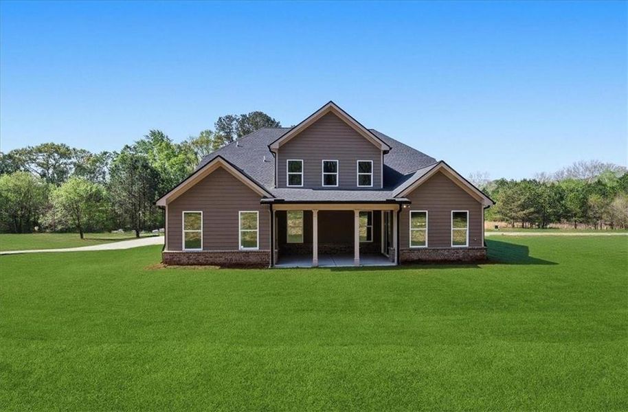 Front exterior of a new home in , Hoschton, GA, highlighting curb appeal (Image 30).