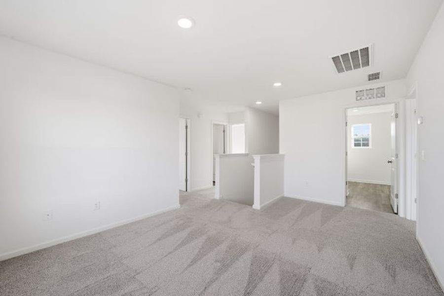 A hallway with white walls. A hallway with white walls.