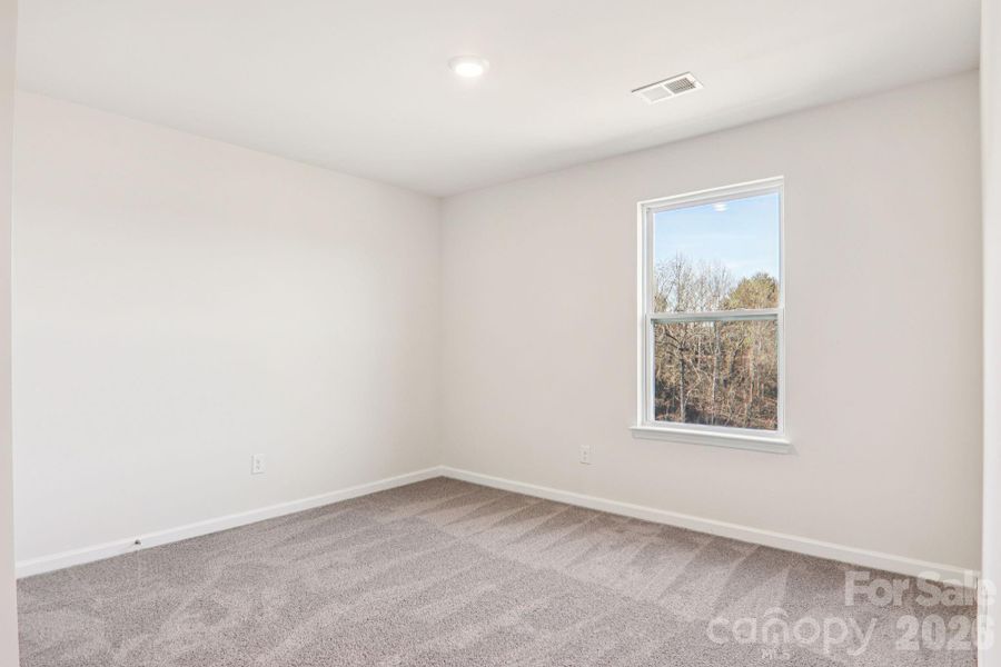 Spacious, unfurnished interior of a new home in Rydele Heights, Asheville (Image 28).
