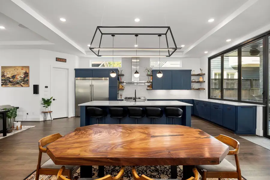 Premium built-in Electrolux fridge and freezer set, with convenient access to a generous walk-in pantry.