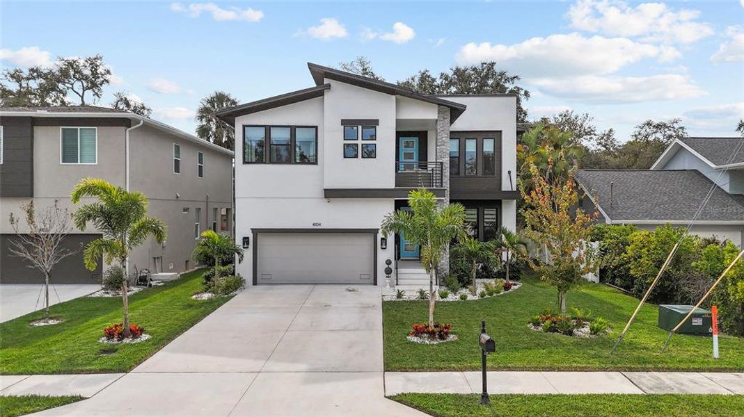 Front exterior of a new home in , Tampa, FL, highlighting curb appeal (Image 25). Front exterior of a new home in , Tampa, FL, highlighting curb appeal (Image 25).