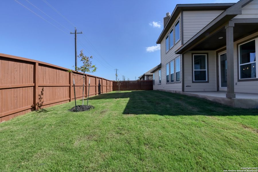 Exterior details and patio area of a home in Megan's Landing 70's, Castroville (Image 3).