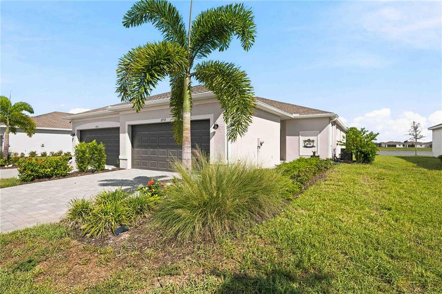Front exterior of a new home in , Englewood, FL, highlighting curb appeal (Image 22). Front exterior of a new home in , Englewood, FL, highlighting curb appeal (Image 22).