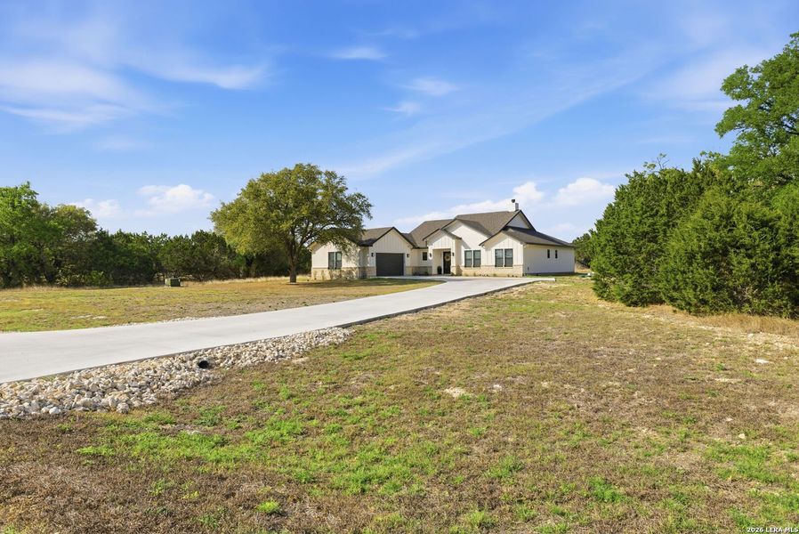 Front exterior of a new home in , Bandera, TX, highlighting curb appeal (Image 28).