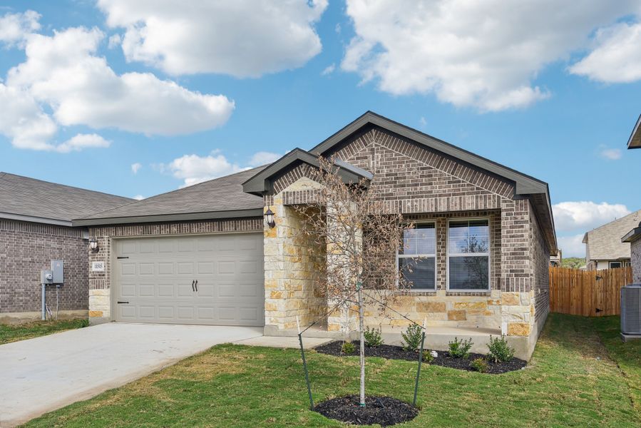 Front exterior of a new home in Lexington Parke, Del Valle, TX, highlighting curb appeal (Image 19).