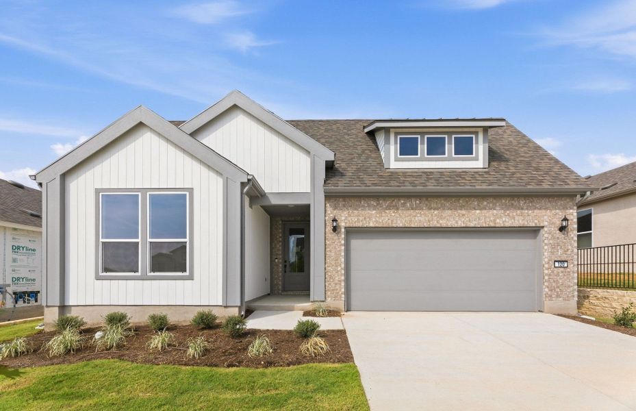 Front exterior of a new home in Sun City Texas, Georgetown, TX, highlighting curb appeal (Image 25). Front exterior of a new home in Sun City Texas, Georgetown, TX, highlighting curb appeal (Image 25).