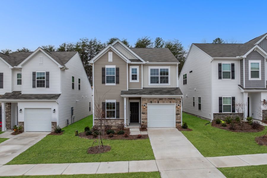 Front exterior of a new home in Spring Park, Travelers Rest, SC, highlighting curb appeal (Image 1). Front exterior of a new home in Spring Park, Travelers Rest, SC, highlighting curb appeal (Image 1).