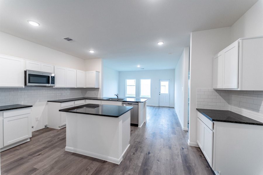 Furnished interior view inside a new home in Sweetgrass Village, Crosby (Image 5).