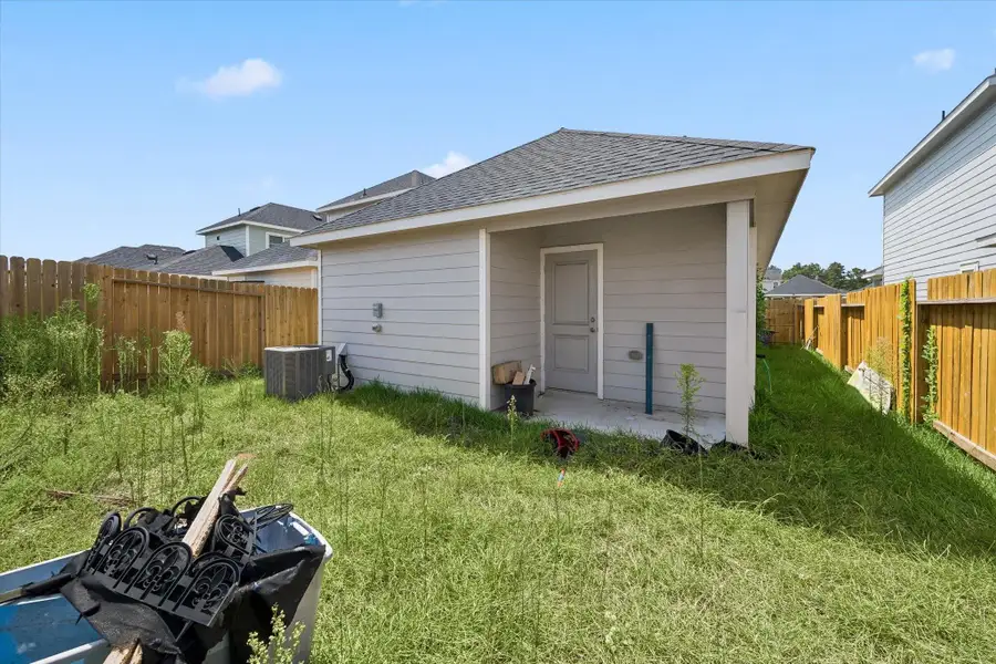 Exterior details and patio area of a home in , Conroe (Image 2). Exterior details and patio area of a home in , Conroe (Image 2).