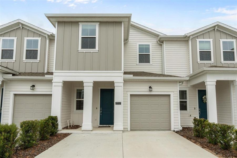Front exterior of a new home in Lake Wilson Reserve, Kissimmee, FL, highlighting curb appeal (Image 1). Front exterior of a new home in Lake Wilson Reserve, Kissimmee, FL, highlighting curb appeal (Image 1).