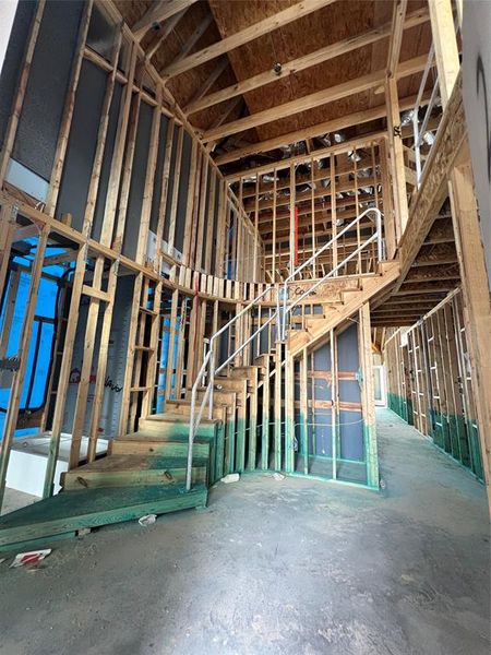 Gorgeously grand curved staircase invites you in to this home. Swipe over to see a representation of this space once completed.