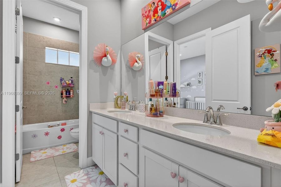 Bathroom 2 serves Bedrooms 2 and 3 and includes a separate water closet for privacy and convenience.