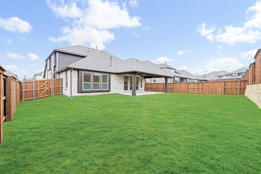 Exterior details and patio area of a home in Windsong Ranch Classic 61, Prosper (Image 28).